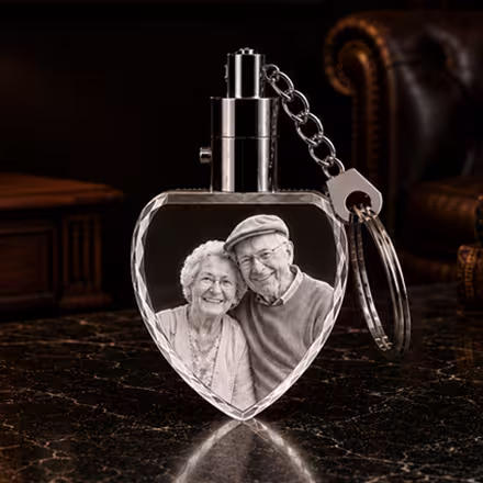 Personalized 2D heart crystal photo keychain featuring a custom portrait of a smiling elderly couple.