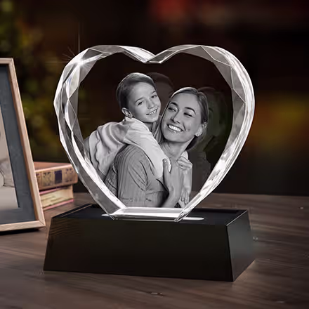 Mother and child portrait engraved inside a 3D Crystal Gem Heart, displayed on a black LED light base.