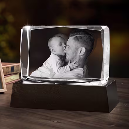 Father and baby portrait engraved inside a 3D Crystal Gem Rectangle, displayed on a black LED light base beside the original photo.