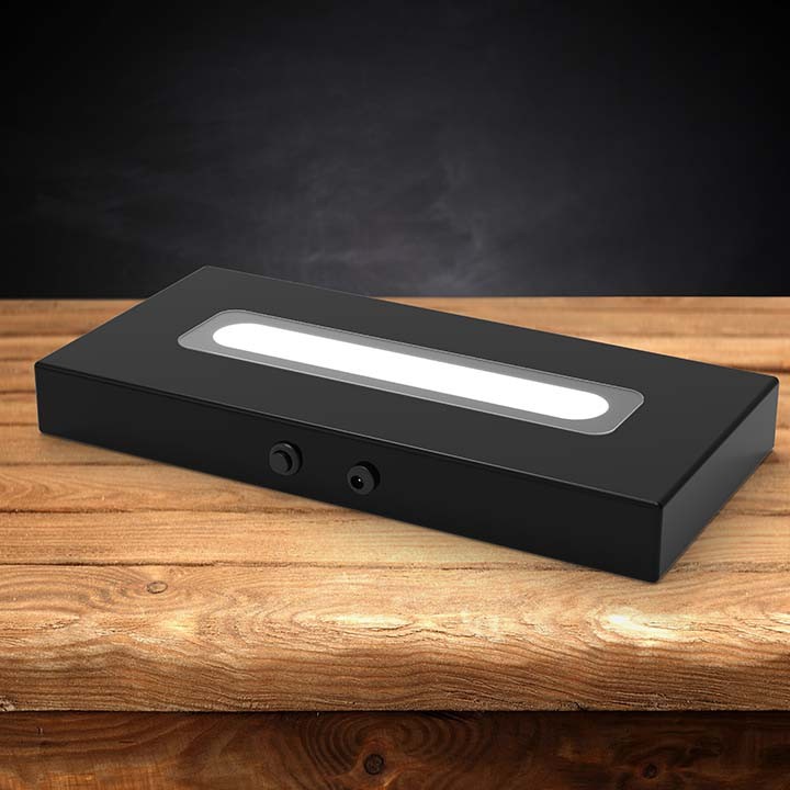 Wood LED light base with a dark background