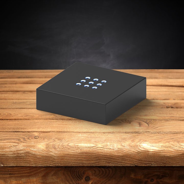 A plastic black light base for 3D photo crystals